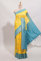 Yellow shade checked and butta banarasi silk saree with teal blue contrast zari border and buttas blouse