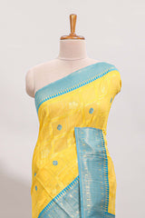 Yellow shade checked and butta banarasi silk saree with teal blue contrast zari border and buttas blouse