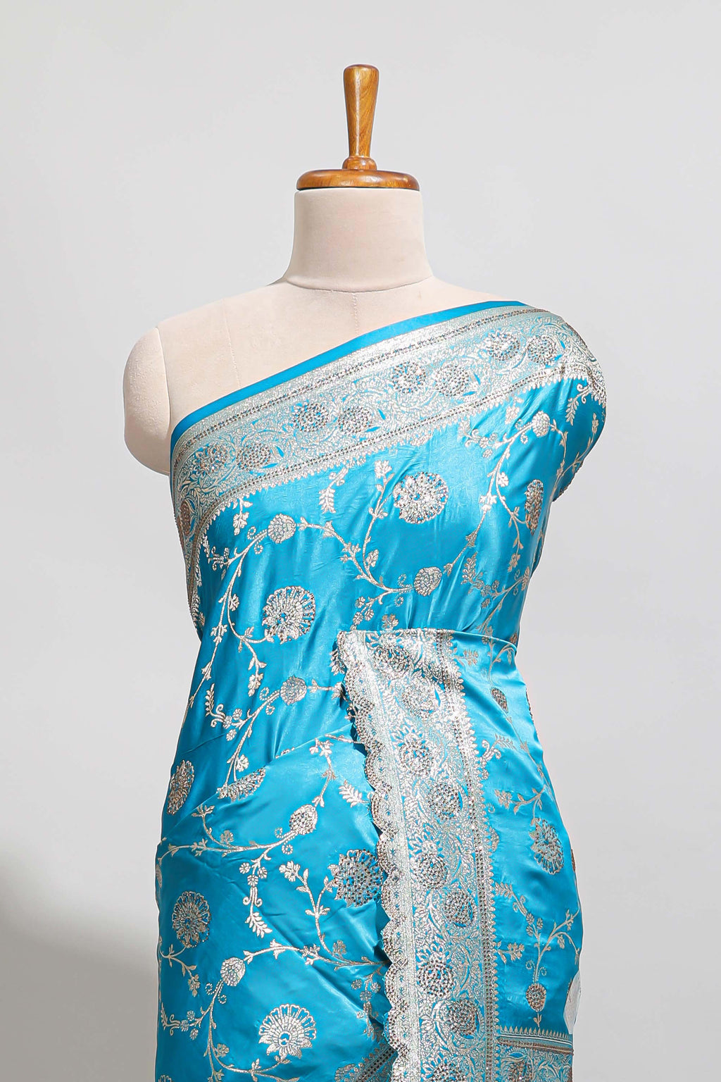 Blue shade floral designed banarasi silk saree with self zari border and blouse