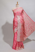 Peach floral designed banarasi silk saree with self zari border and blouse