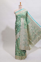 Sea green floral designed banarasi silk saree with self zari border and blouse