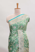 Sea green floral designed banarasi silk saree with self zari border and blouse