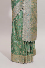 Sea green floral designed banarasi silk saree with self zari border and blouse