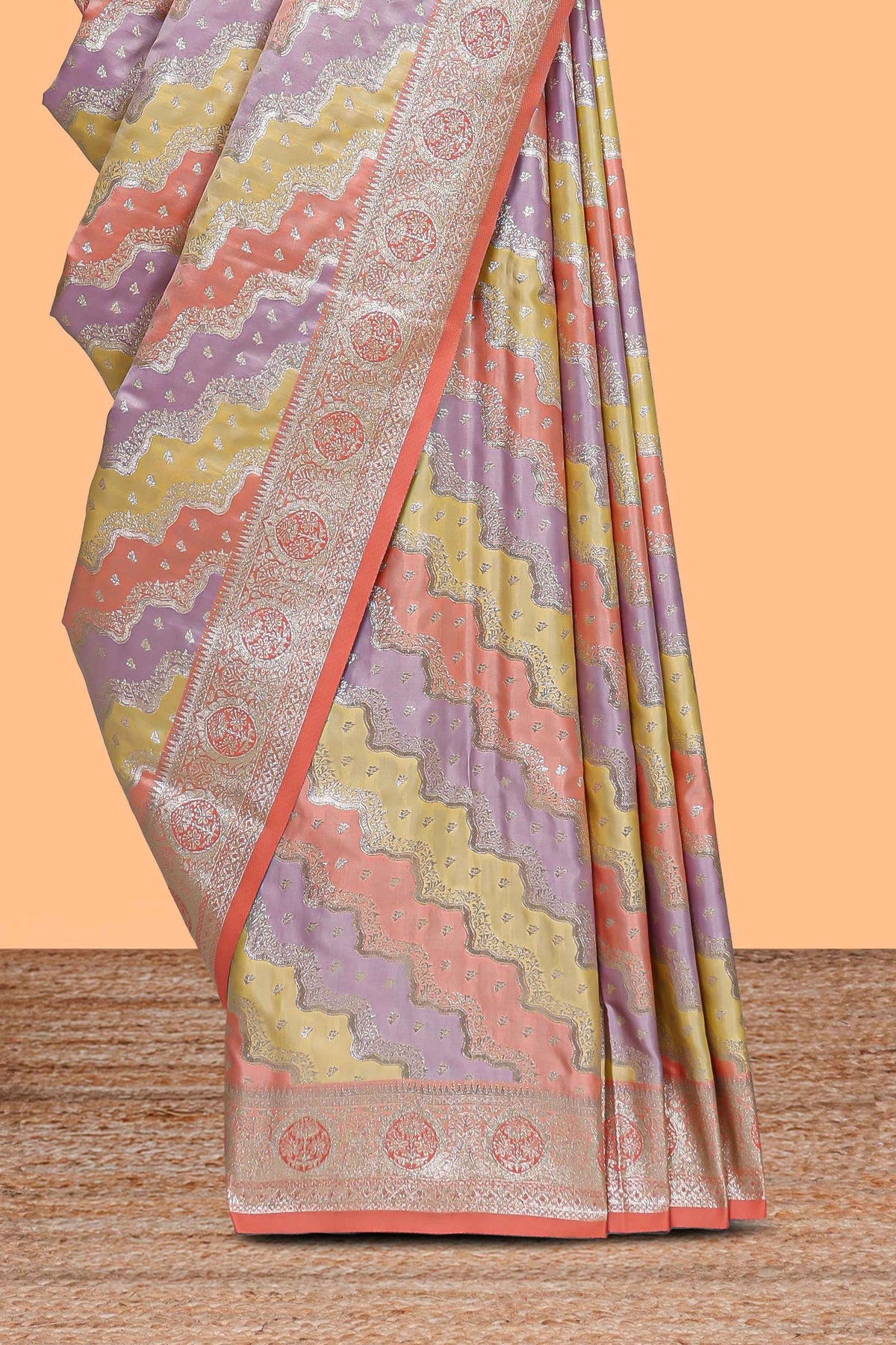 Peach multicolor striped banarasi silk saree with self zari border and  matching blouse
