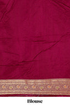 Red banarasi silk saree with contrast zari border and blouse