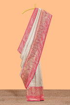 Cream unique designed banarasi silk saree with contrast floral zari border and blouse