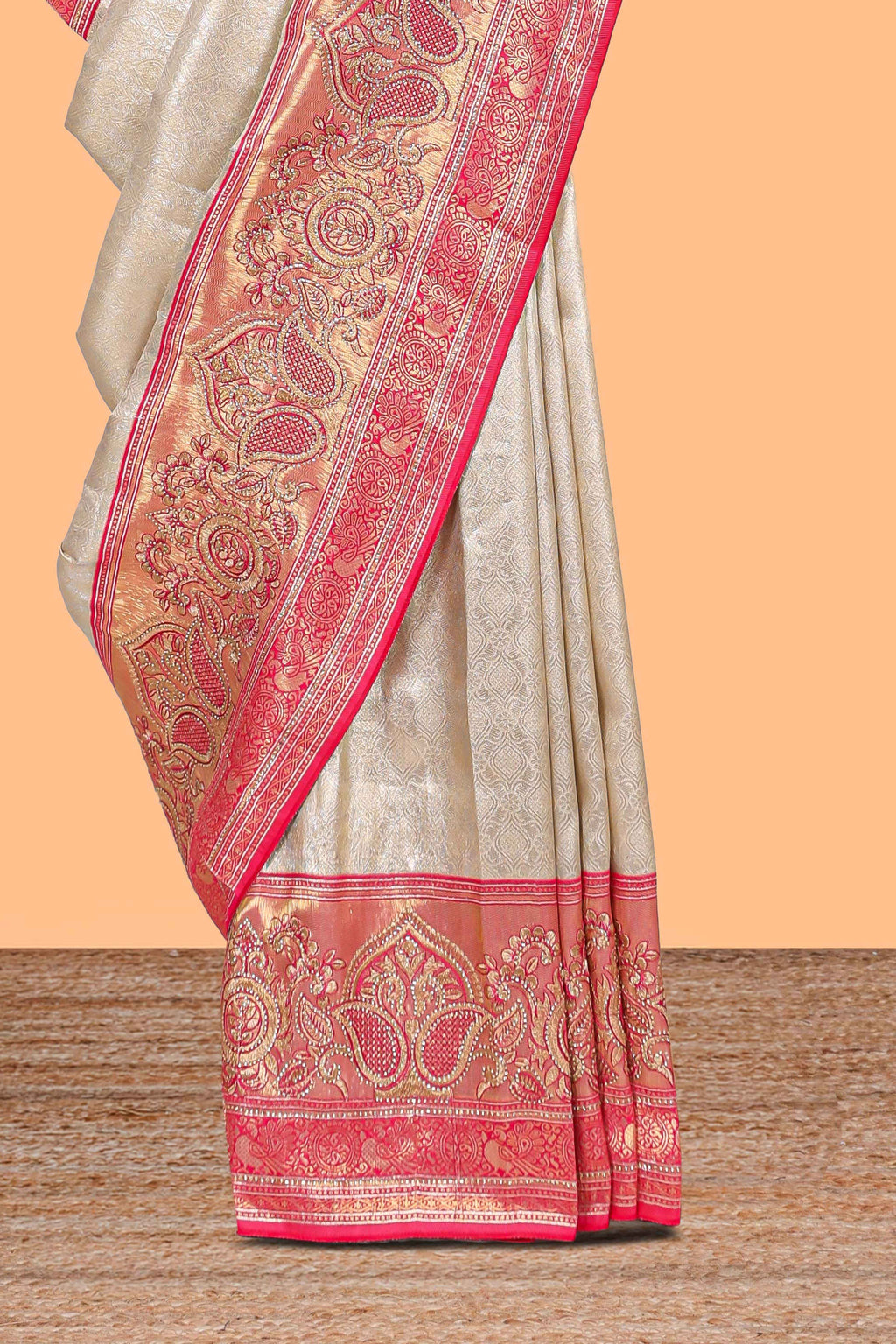 Cream unique designed banarasi silk saree with contrast floral zari border and blouse