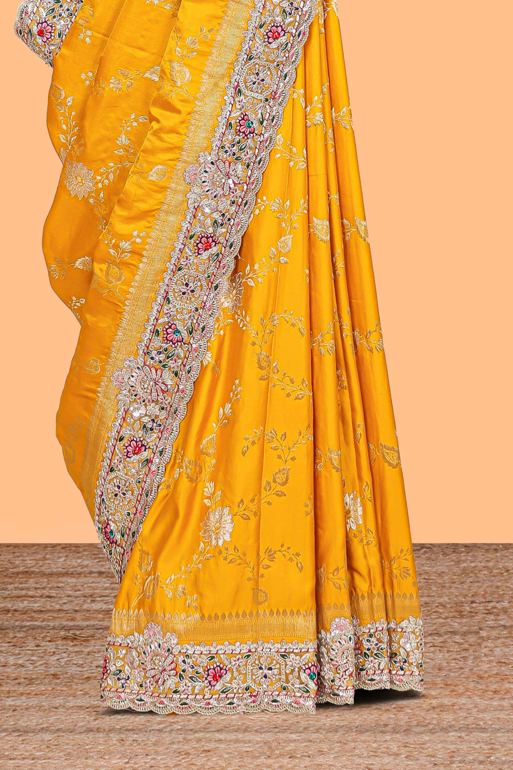 Yellow floral designed banarasi silk saree with self floral embroidery border and matching blouse