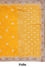Yellow floral designed banarasi silk saree with self floral embroidery border and matching blouse
