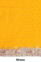 Yellow floral designed banarasi silk saree with self floral embroidery border and matching blouse