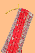 Red floral designed banarasi silk saree with self floral embroidery border and matching blouse