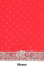 Red floral designed banarasi silk saree with self floral embroidery border and matching blouse