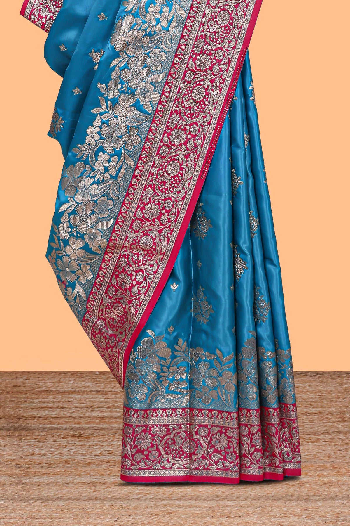 Blue floral designed banarasi silk saree with contrast floral border and matching blouse