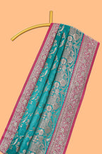 Green floral designed banarasi silk saree with contrast floral border and matching blouse