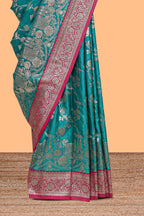 Green floral designed banarasi silk saree with contrast floral border and matching blouse