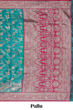 Green floral designed banarasi silk saree with contrast floral border and matching blouse