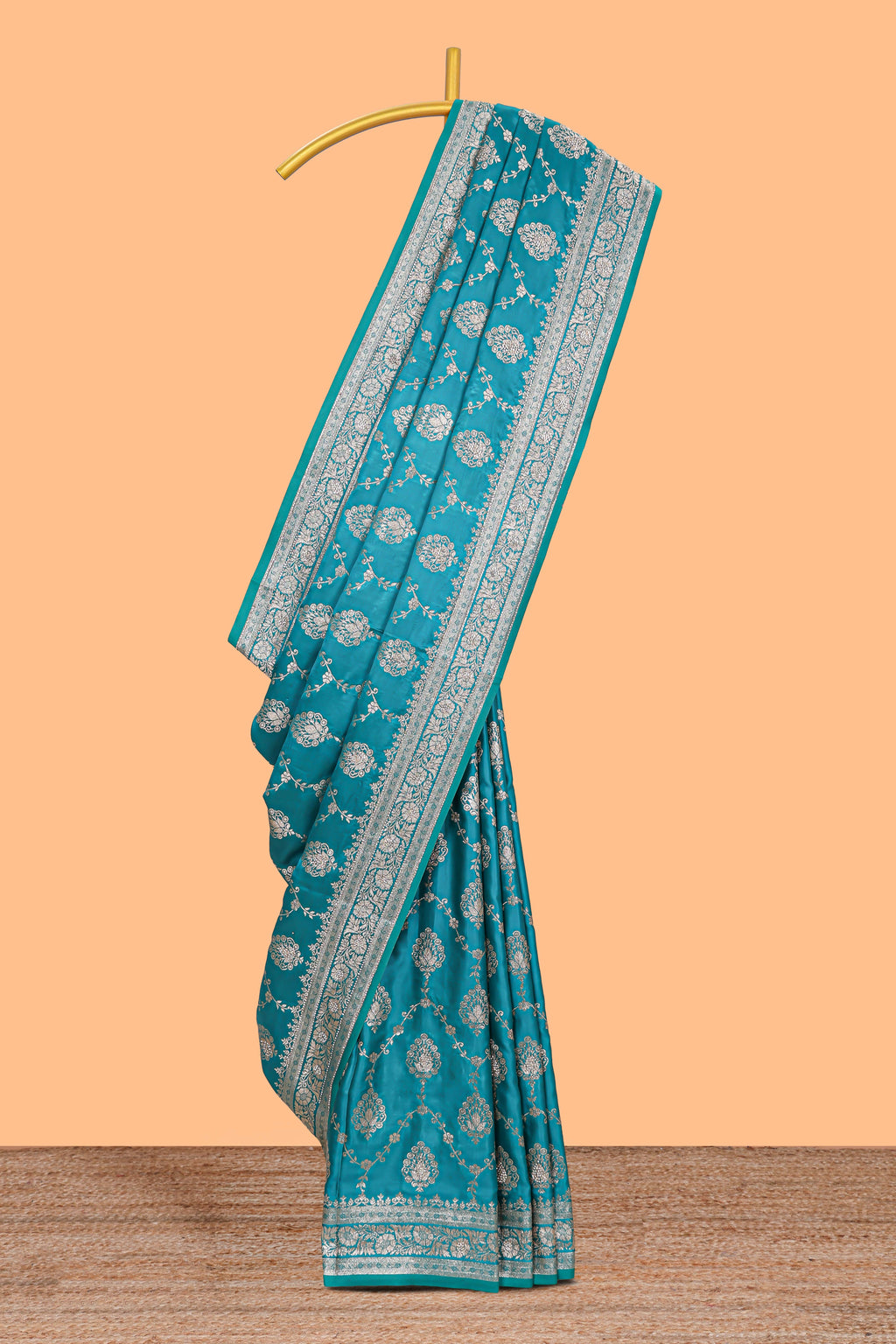 Blue floral designed banarasi silk saree with self floral border and matching blouse