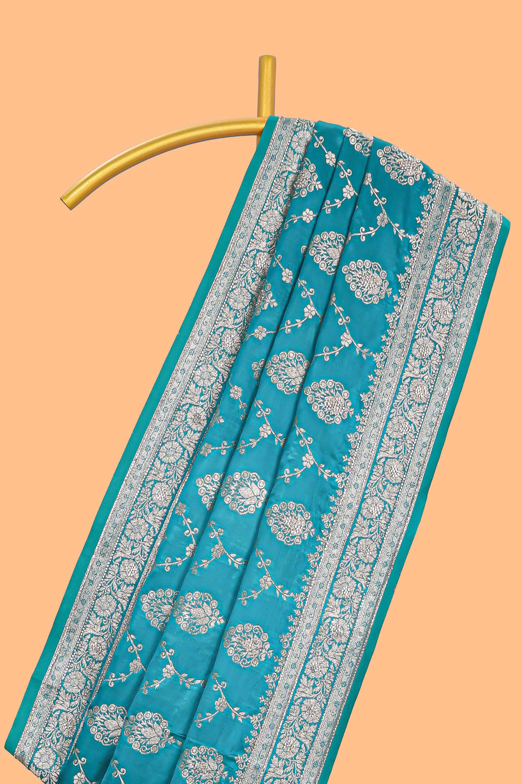 Blue floral designed banarasi silk saree with self floral border and matching blouse