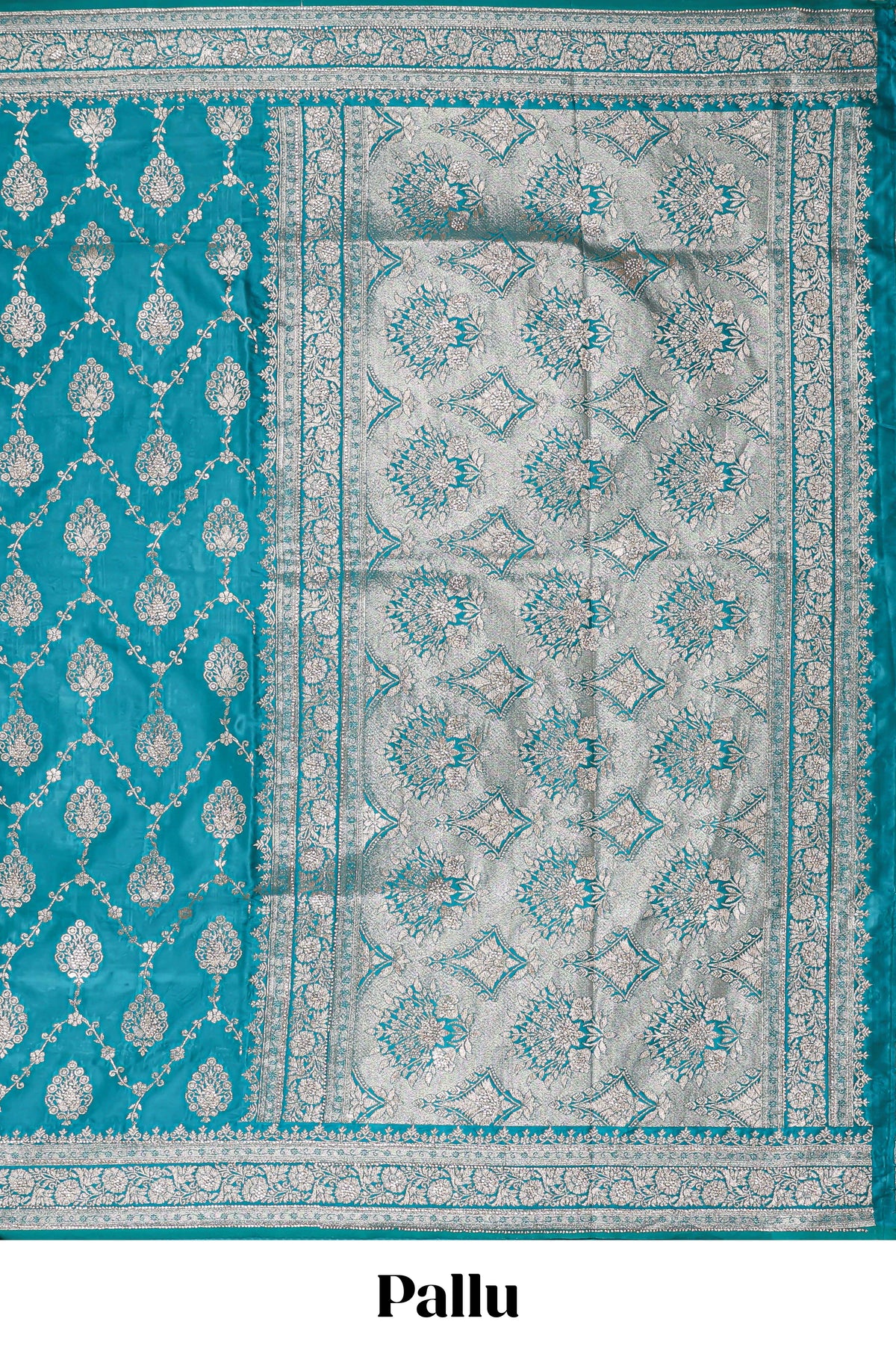 Blue floral designed banarasi silk saree with self floral border and matching blouse