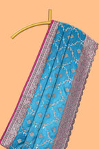 Peacock blue floral designed banarasi silk saree with self floral border and matching blouse