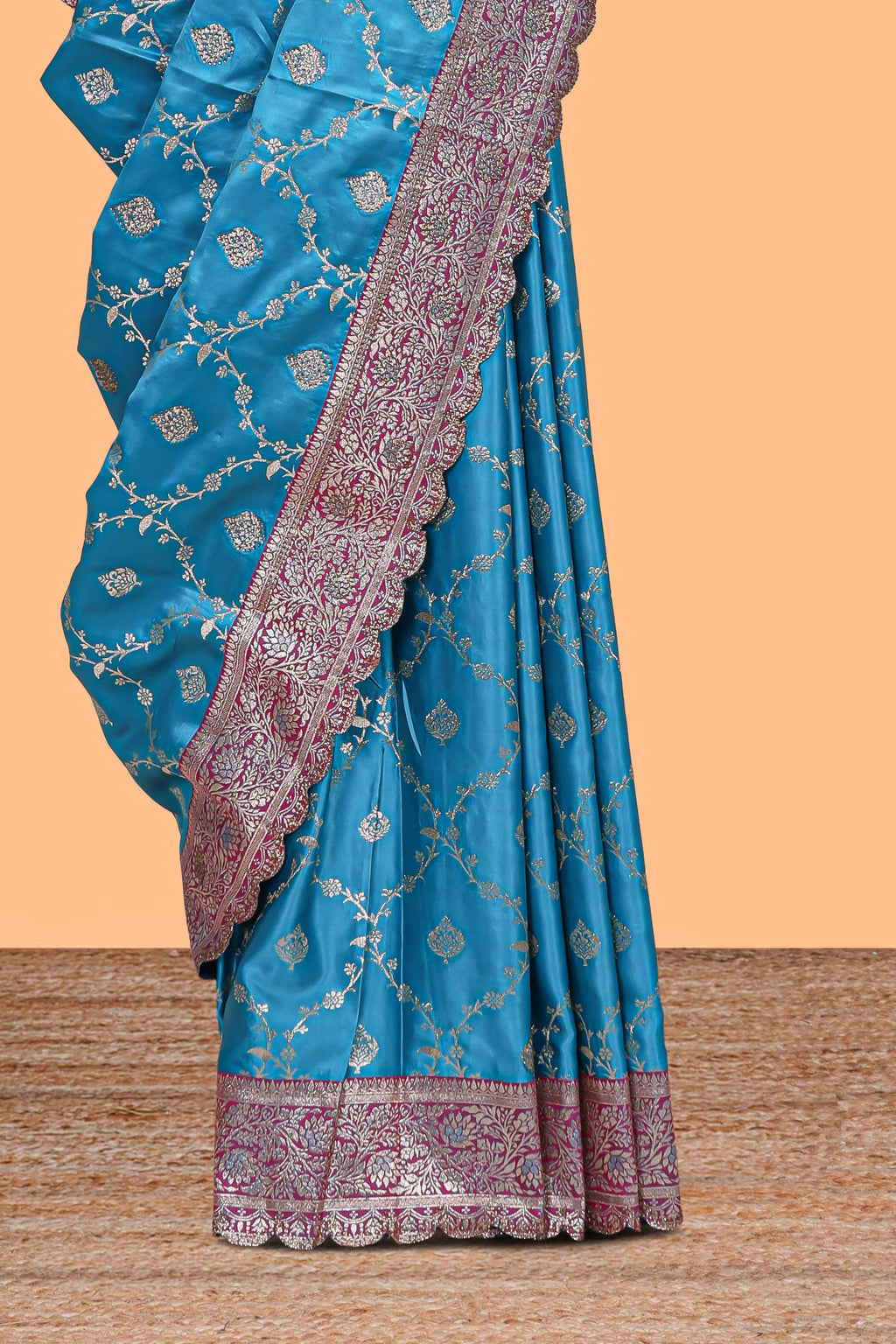 Peacock blue floral designed banarasi silk saree with self floral border and matching blouse