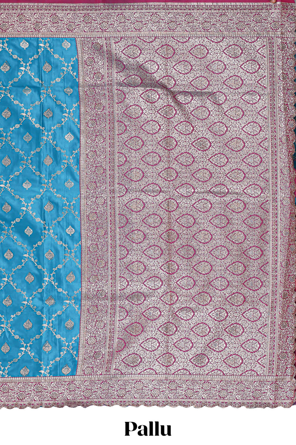Peacock blue floral designed banarasi silk saree with self floral border and matching blouse