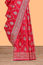 Red floral designed banarasi silk saree with self floral border and matching blouse