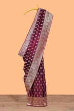 Deep plum butta designed banarasi silk saree with self zari border and matching blouse