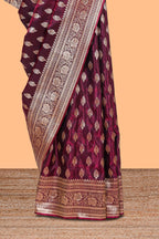 Deep plum butta designed banarasi silk saree with self zari border and matching blouse