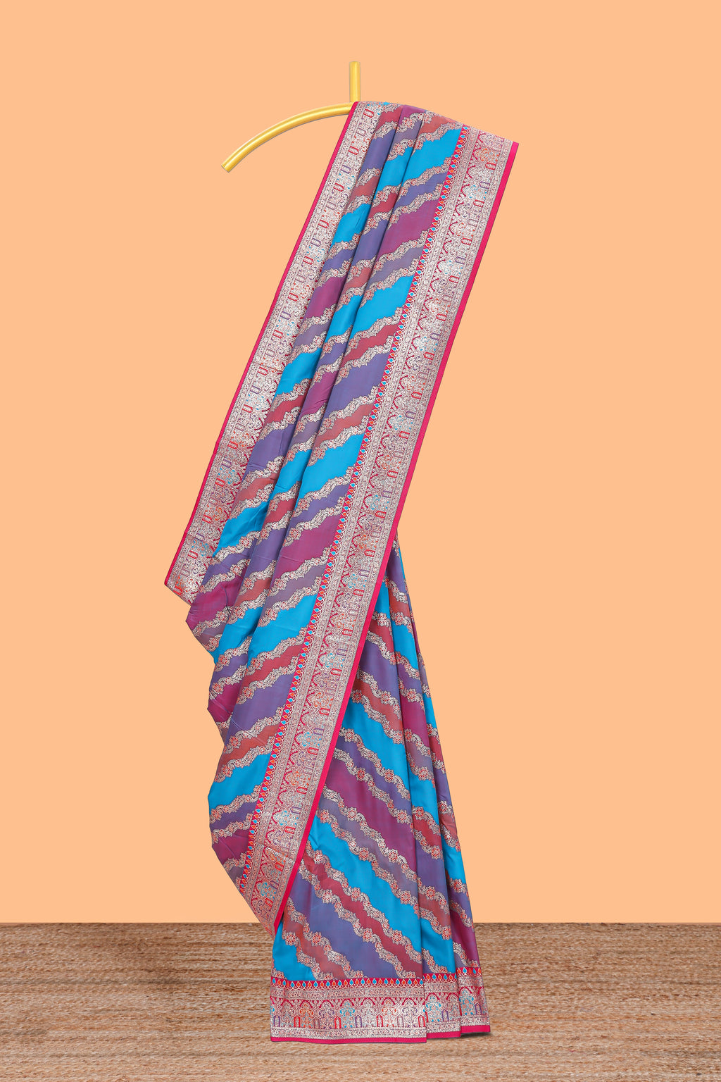 Multicolor chevron designed banarasi silk saree with contrast traditional zari border and matching blouse