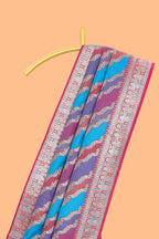 Multicolor chevron designed banarasi silk saree with contrast traditional zari border and matching blouse