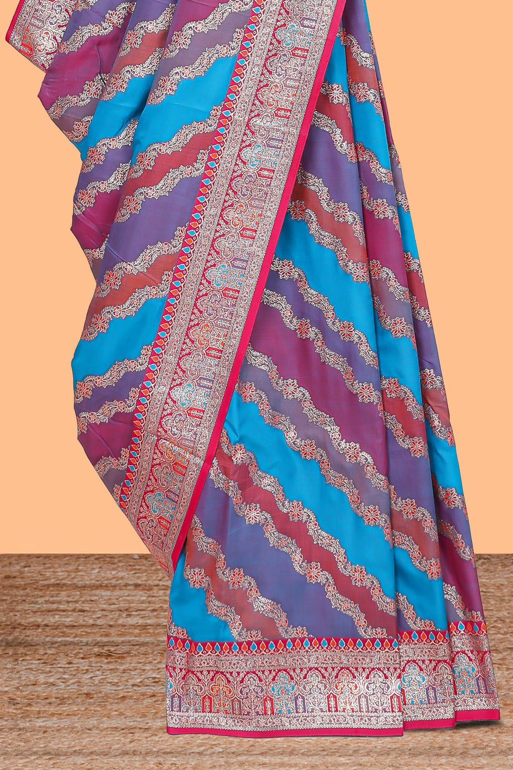 Multicolor chevron designed banarasi silk saree with contrast traditional zari border and matching blouse