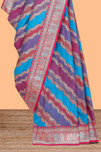 Multicolor chevron designed banarasi silk saree with contrast traditional zari border and matching blouse
