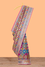 Multicolor geometric tile pattern banarasi silk saree with intricate contrast zari border and blouse