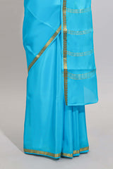 Sky blue plain design pure mysore silk saree with contrast border and matching blouse