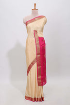 Cream polka dot designed  pure mysore silk saree with contrast border and blouse