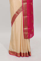Cream polka dot designed  pure mysore silk saree with contrast border and blouse