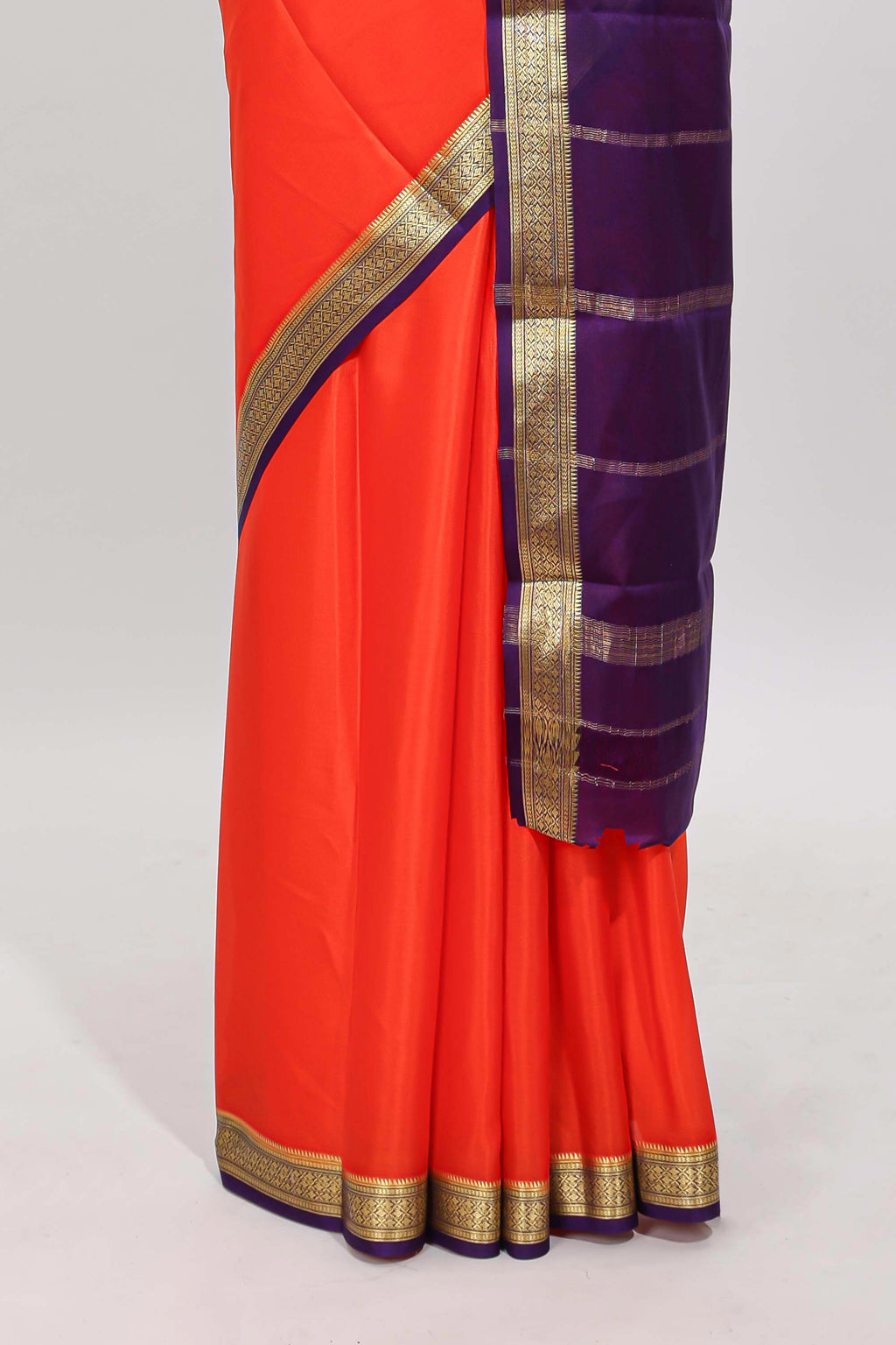 Orange plain pure mysore silk saree with contrast border and blouse