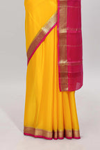 Yellow plain pure mysore silk saree with contrast border and blouse