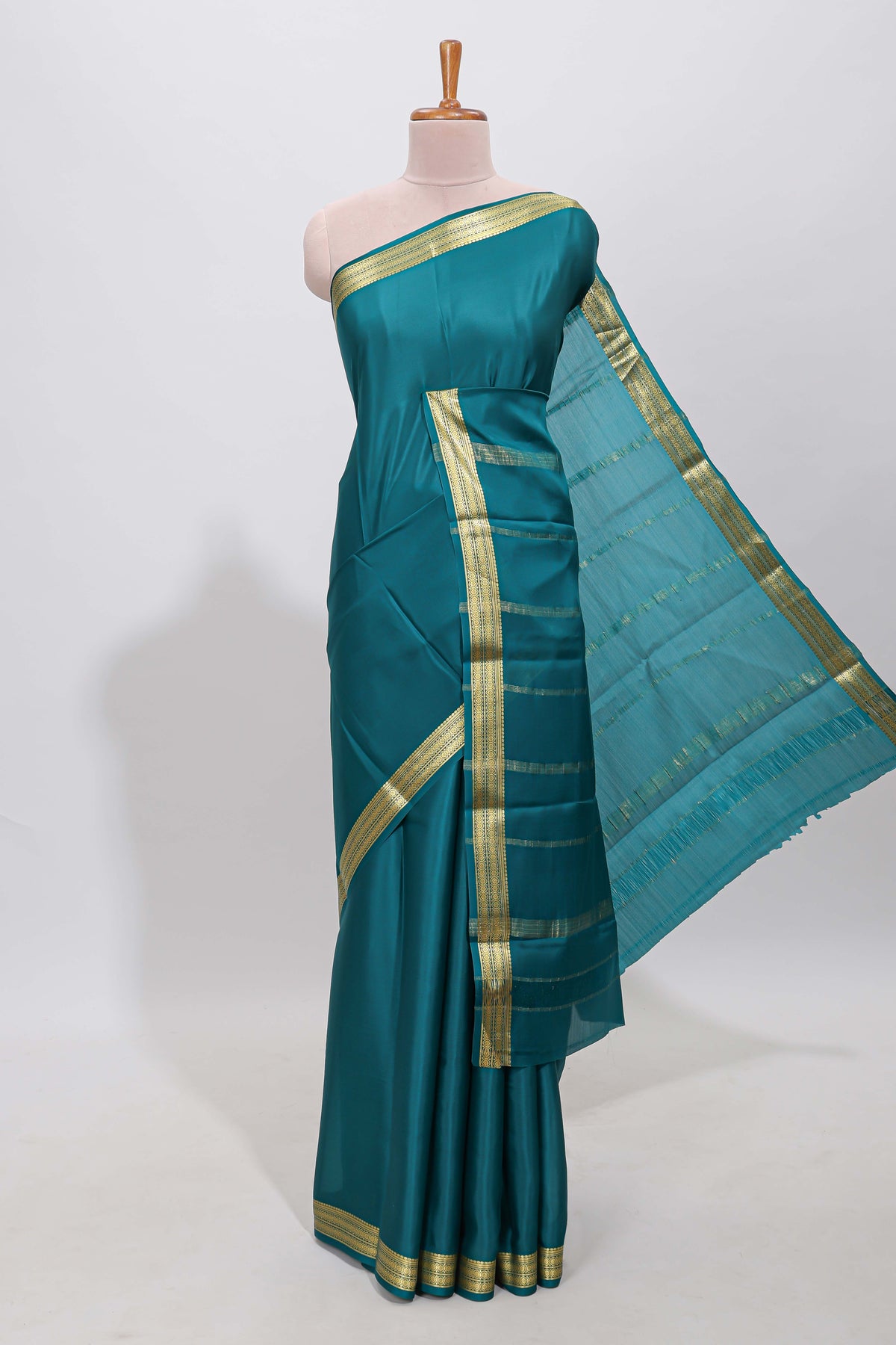 Teal blue plain pure mysore silk saree with self zari border and matching blouse