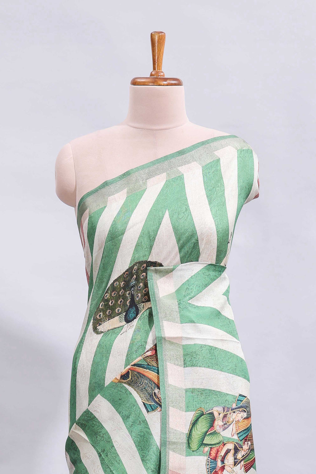 Off white & green striped peacock motifs design and self border and printed blouse