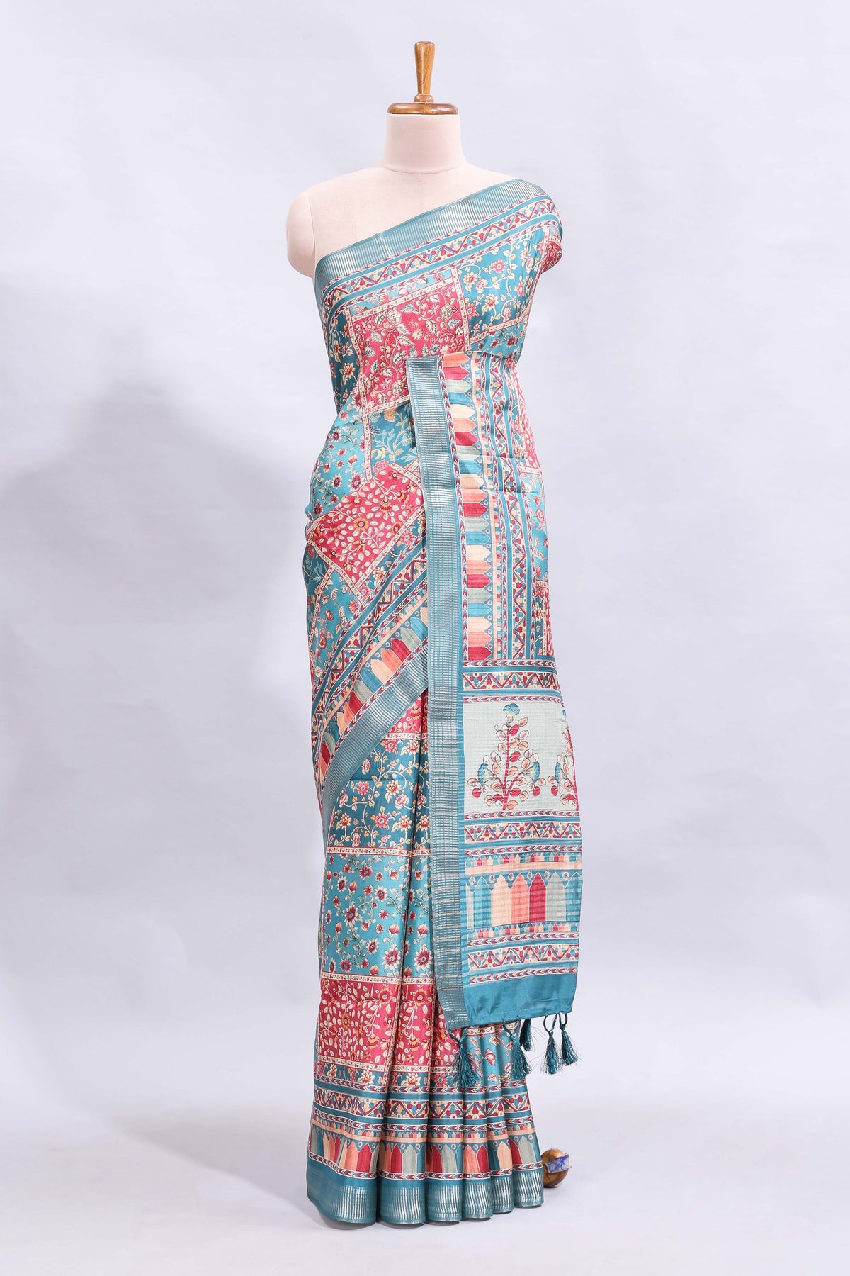 Blue floral design printed saree and self geometric design border and striped blouse