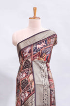 Maroon printed saree with traditional art motifs with contrast zari border and motifs blouse