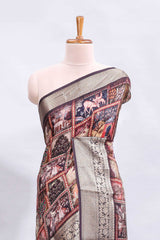Maroon printed saree with traditional art motifs with contrast zari border and motifs blouse