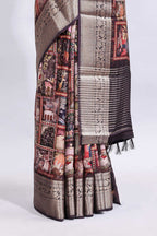 Maroon printed saree with traditional art motifs with contrast zari border and motifs blouse