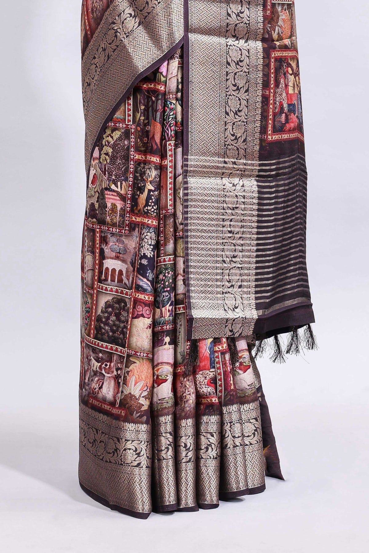 Maroon printed saree with traditional art motifs with contrast zari border and motifs blouse