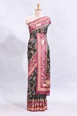 Black traditional theme printed saree with contrast floral & cow design border and plain blouse