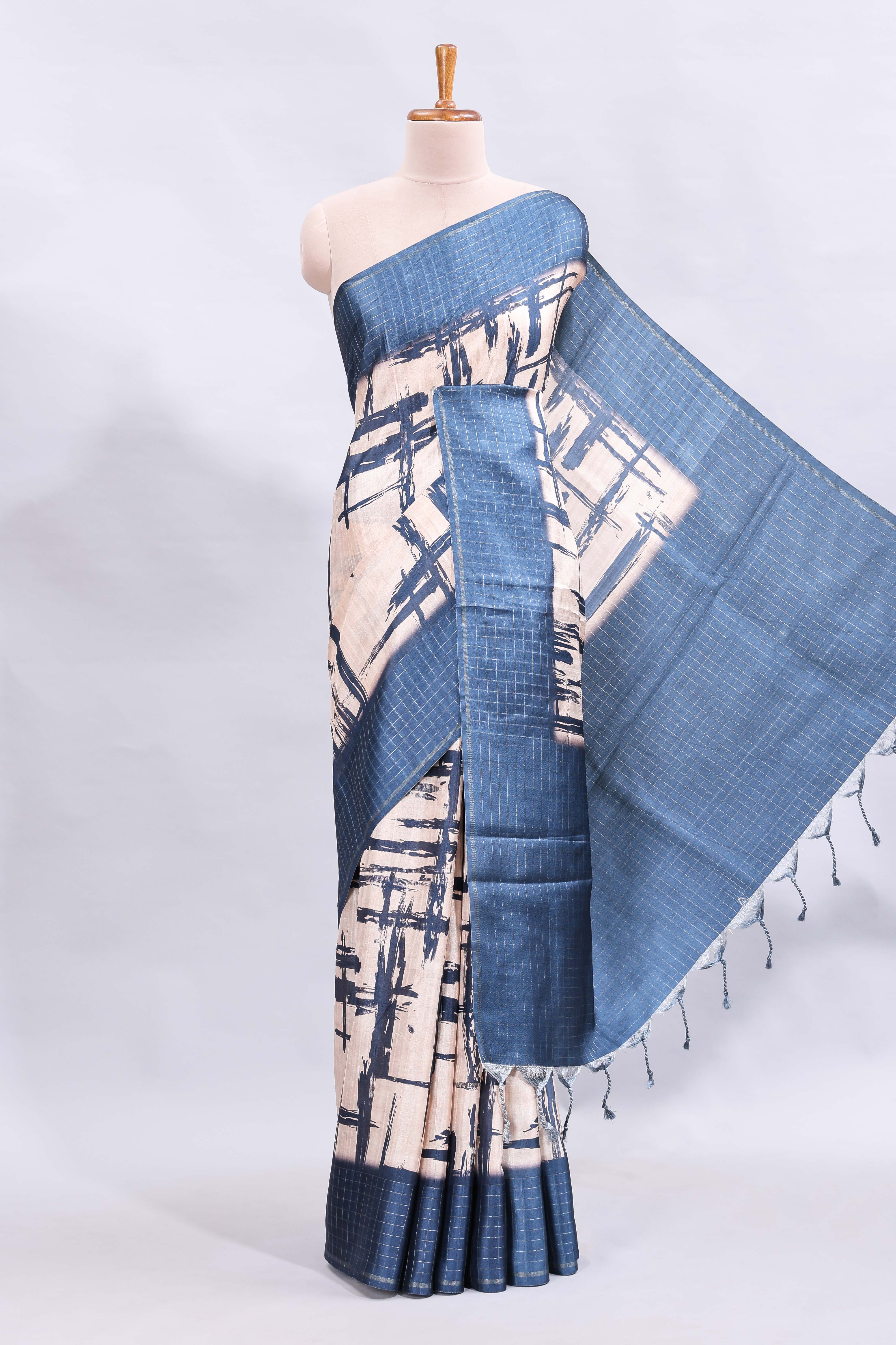 Cream abstract printed saree with contrast checked border and blouse