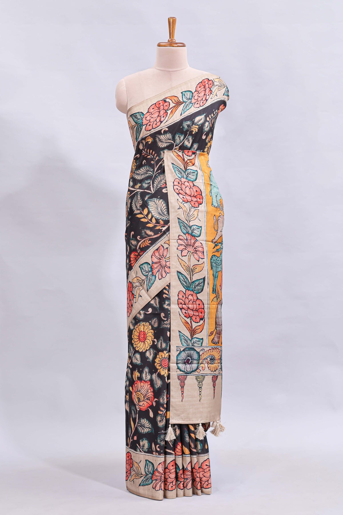 Black kalamkari style floral design printed saree with contrast border and blouse