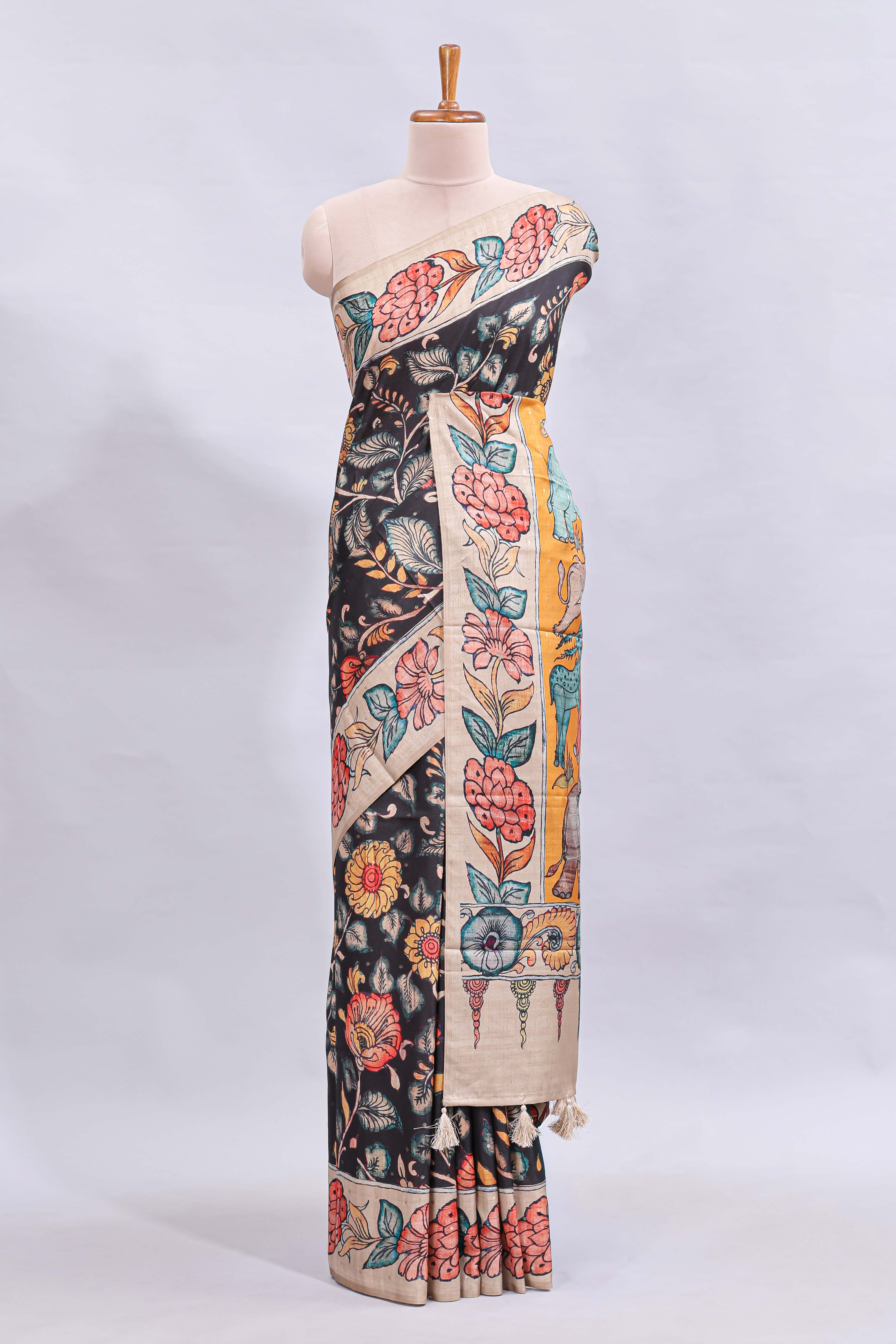 Black kalamkari style floral design printed saree with contrast border and blouse